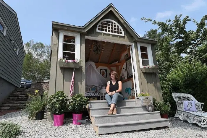 woman enjoying her she shed